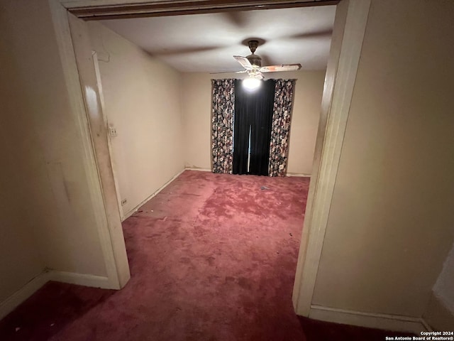 carpeted empty room with ceiling fan