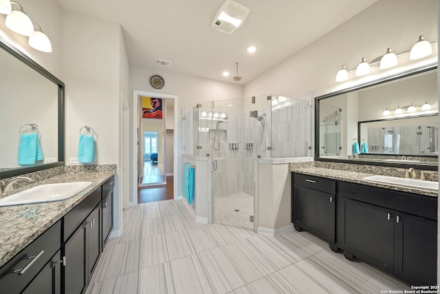 bathroom with an enclosed shower, vanity, and hardwood / wood-style flooring