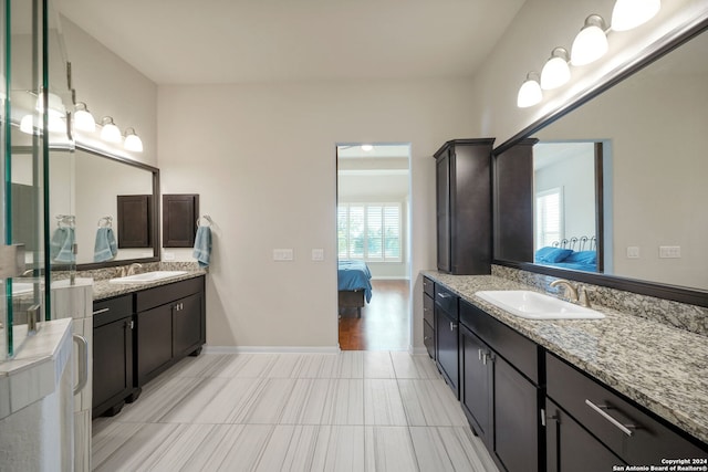 bathroom with vanity and tile floors