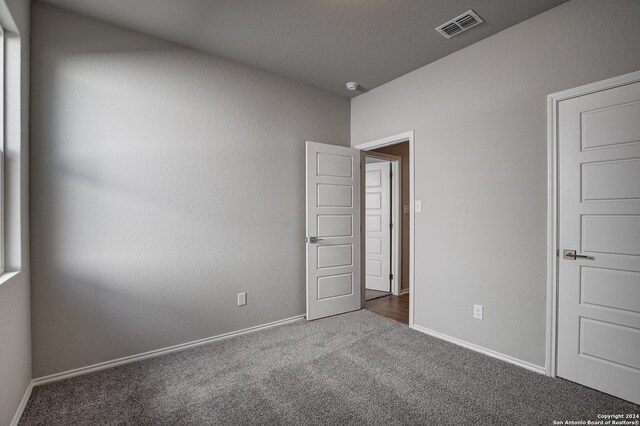 unfurnished bedroom featuring carpet