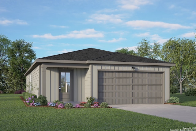 view of front of house with a garage and a front yard