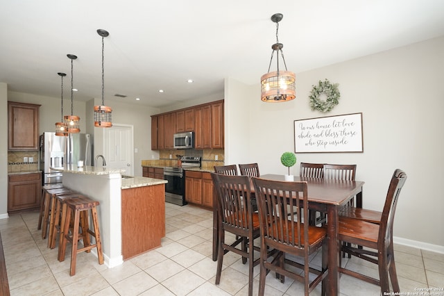 tiled dining area with sink