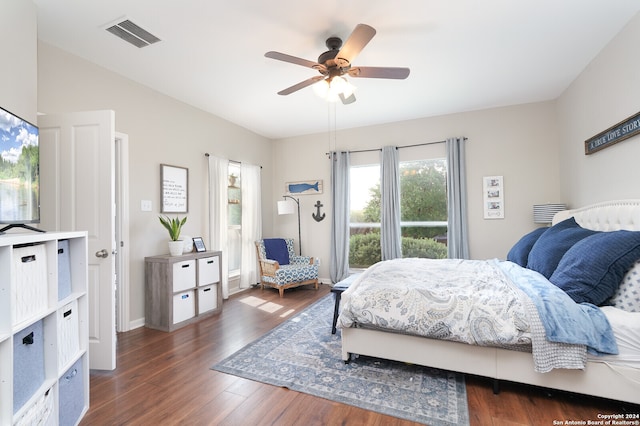 bedroom featuring ceiling fan and dark wood-type flooring