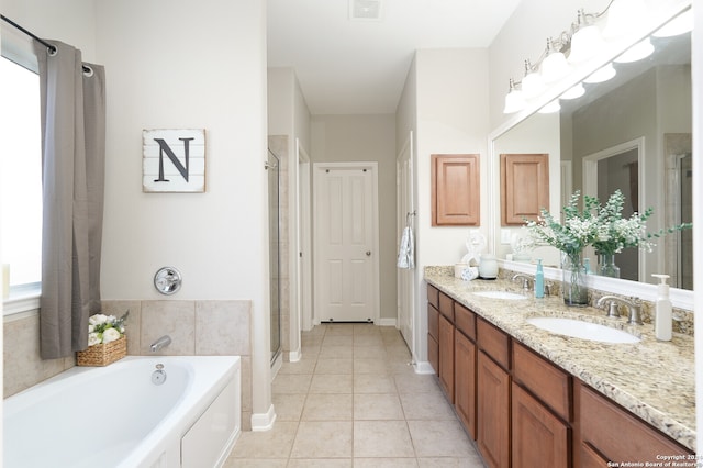 bathroom with tile flooring, double vanity, and shower with separate bathtub