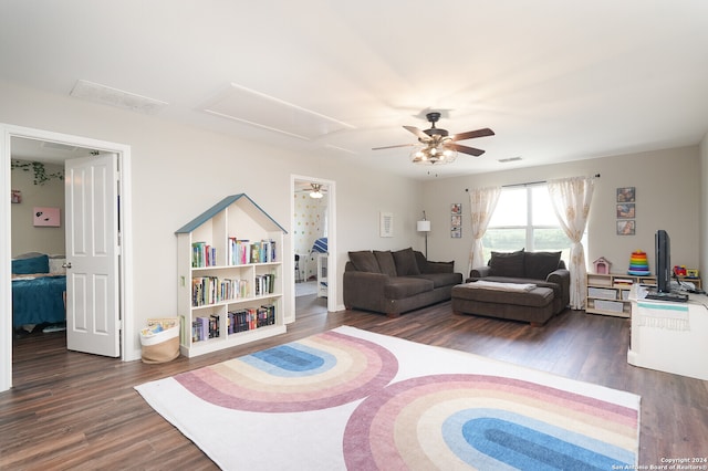 living room featuring dark hardwood / wood-style floors and ceiling fan