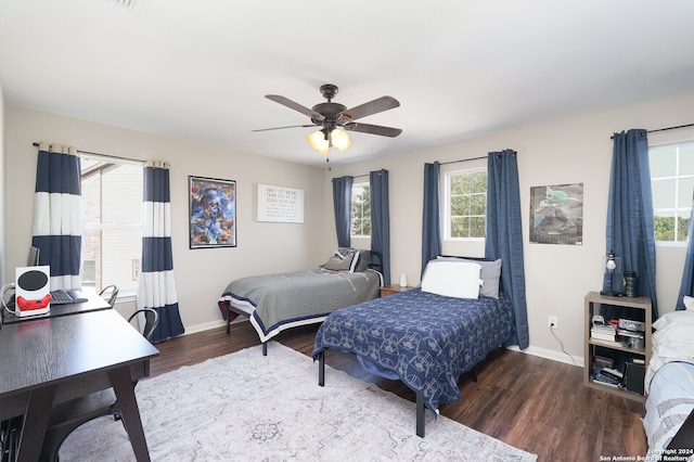 bedroom with wood-type flooring and ceiling fan