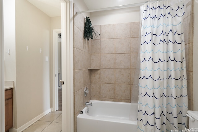 bathroom with shower / tub combo, tile floors, and vanity