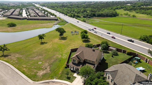 birds eye view of property with a water view