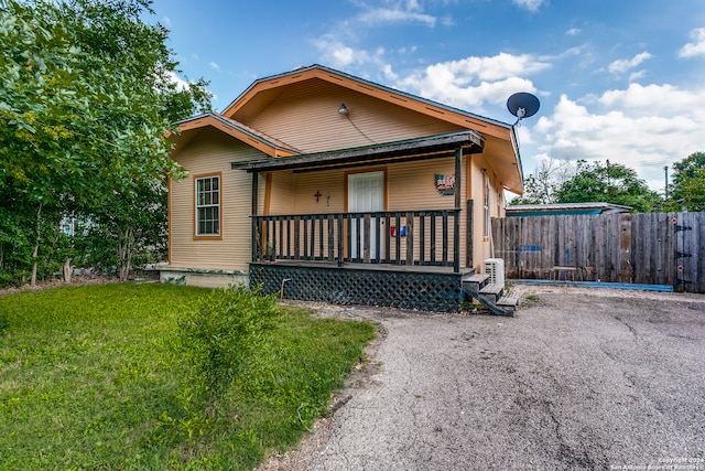 bungalow-style house featuring a front yard