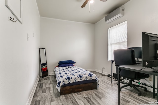 bedroom featuring wood-type flooring, a wall mounted AC, and ceiling fan