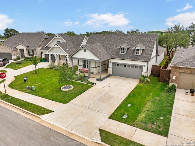 view of front of property featuring a garage and a front lawn