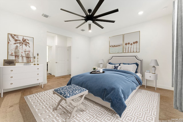 bedroom featuring light colored carpet and ceiling fan