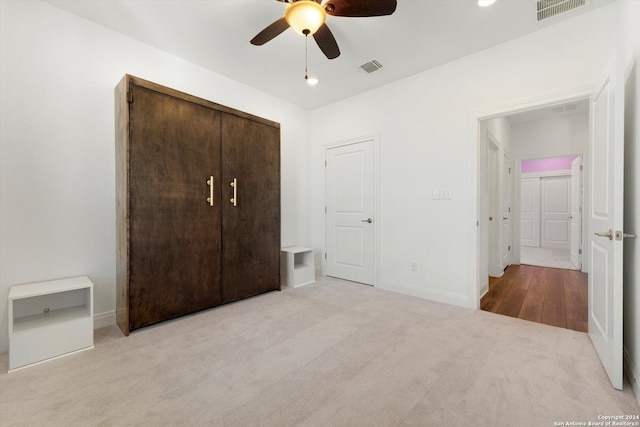 unfurnished bedroom with carpet and ceiling fan