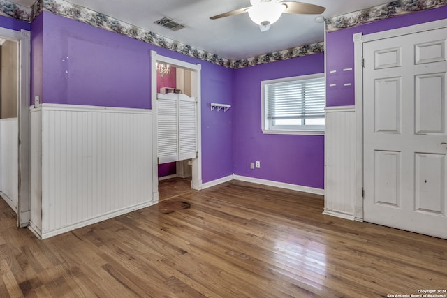 unfurnished bedroom with hardwood / wood-style flooring and ceiling fan