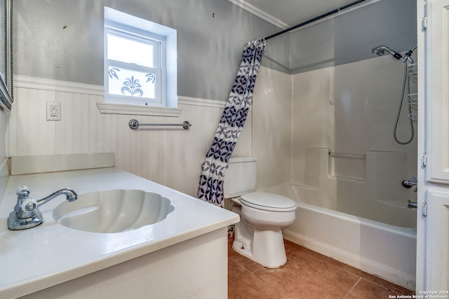 full bathroom with shower / tub combo, toilet, tile floors, and vanity