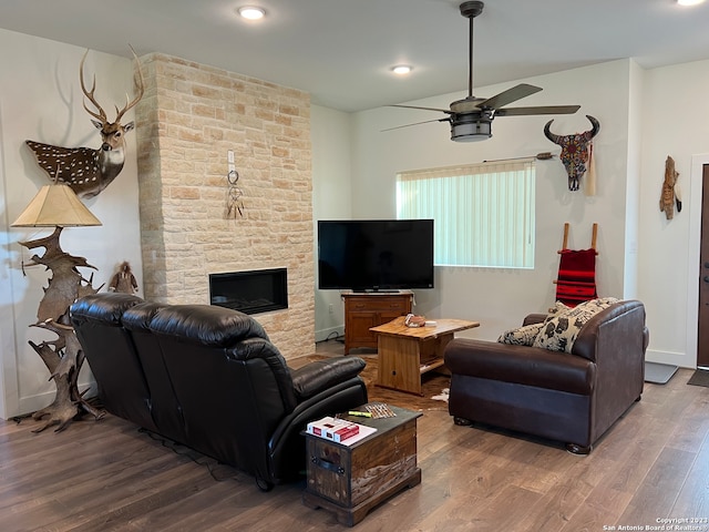 living room with ceiling fan, hardwood / wood-style floors, and a fireplace