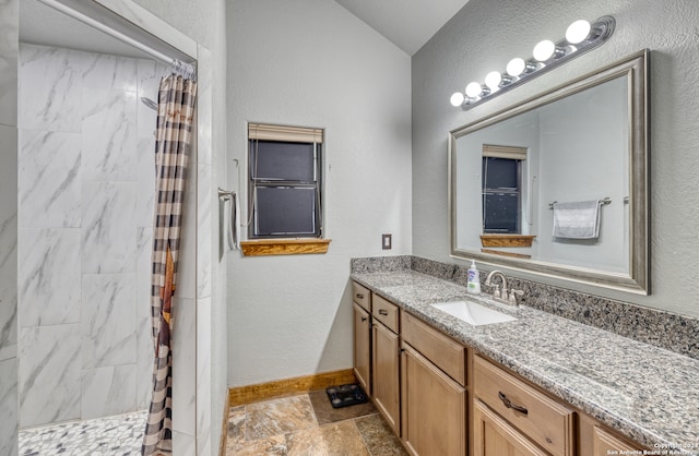 bathroom featuring vanity and tile floors