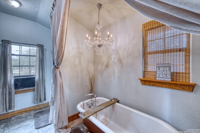 bathroom with a bathing tub, a chandelier, tile flooring, and lofted ceiling