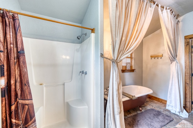 bathroom featuring a textured ceiling and tile flooring