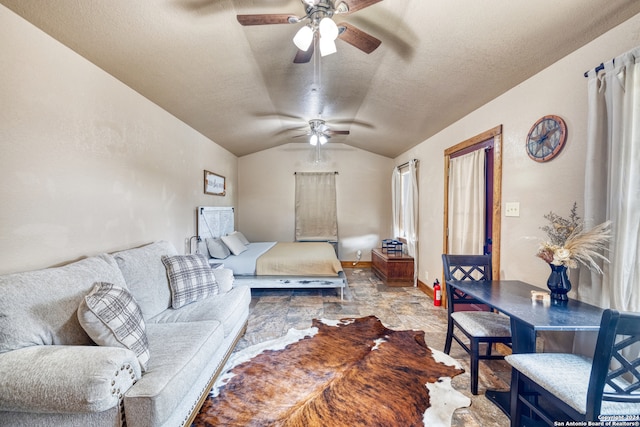 tiled bedroom featuring vaulted ceiling, ceiling fan, and a textured ceiling