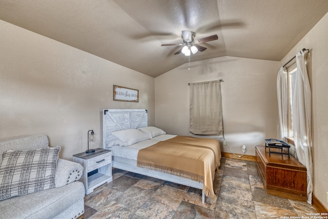 tiled bedroom featuring ceiling fan and lofted ceiling