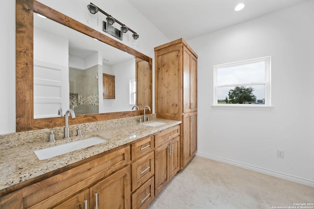 bathroom featuring vanity with extensive cabinet space and double sink