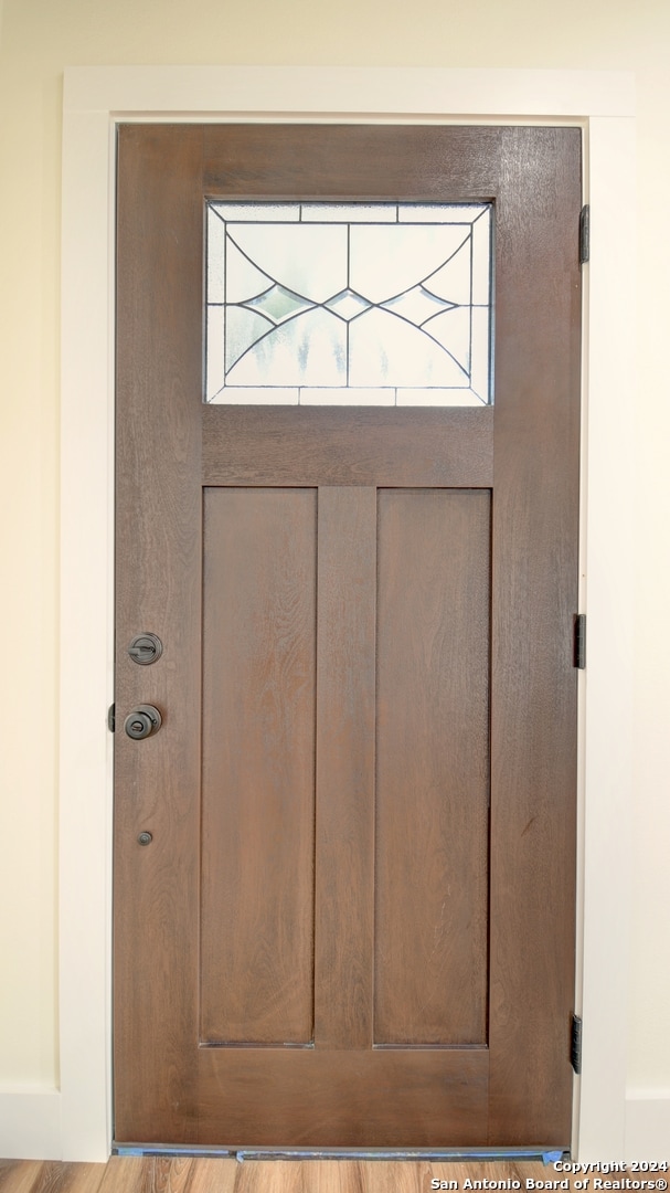 doorway with light hardwood / wood-style flooring