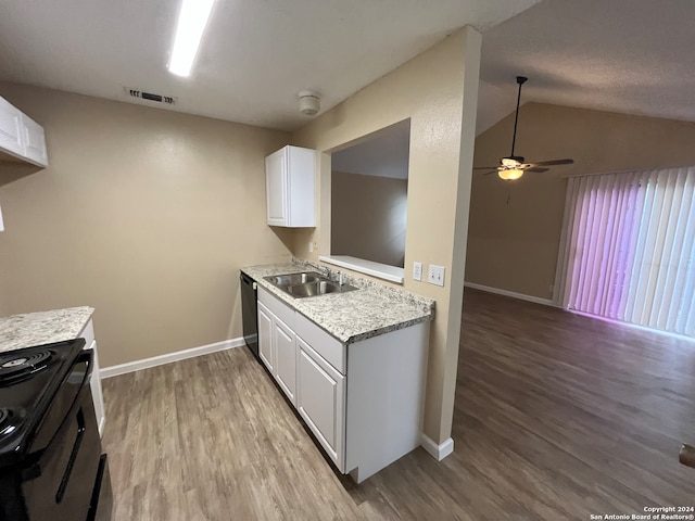 kitchen featuring wood-type flooring, white cabinetry, sink, and lofted ceiling