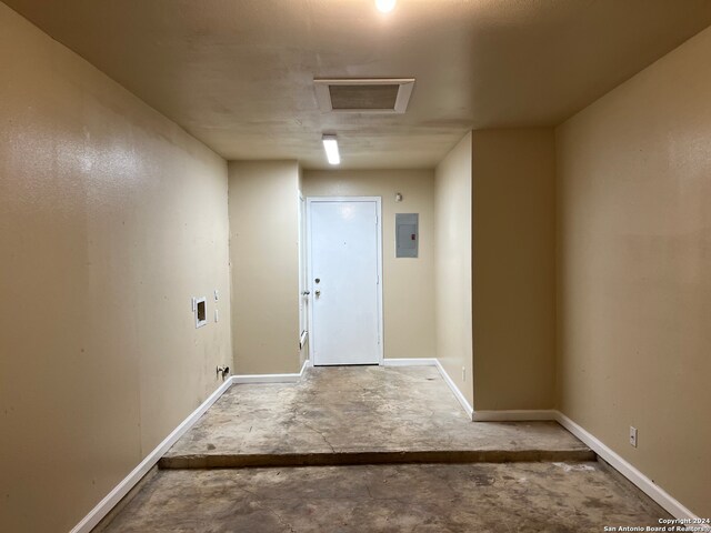 hallway with concrete flooring