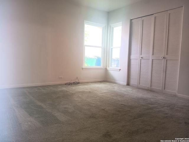 unfurnished bedroom featuring a closet and carpet