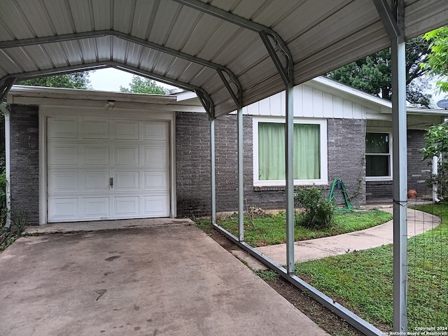 exterior space with a carport and a lawn