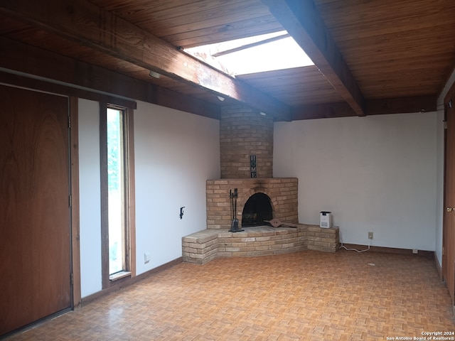 unfurnished living room with a wood stove, a healthy amount of sunlight, parquet flooring, beam ceiling, and wood ceiling