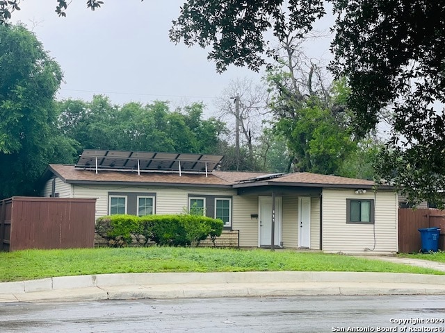 view of front of home featuring solar panels