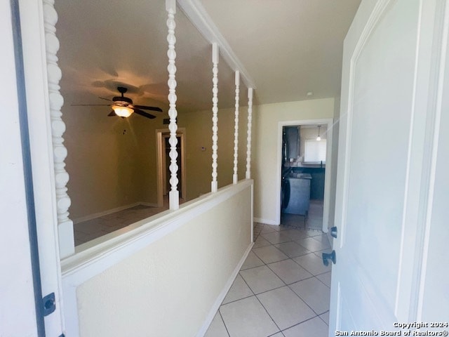 hallway featuring light tile floors