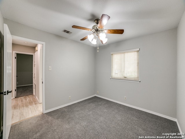 unfurnished room featuring ceiling fan and hardwood / wood-style floors