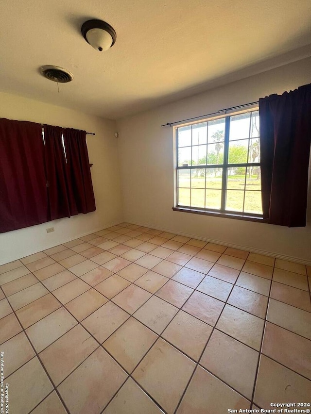 view of tiled spare room