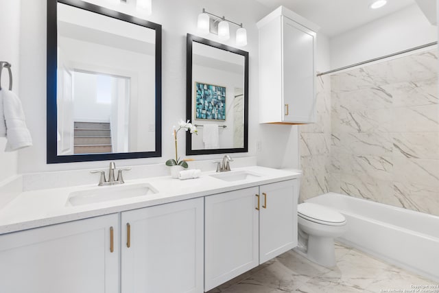 full bathroom with toilet, tiled shower / bath, and vanity