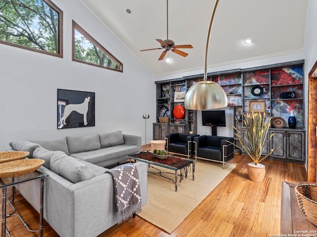 living room with high vaulted ceiling, crown molding, ceiling fan, and hardwood / wood-style floors