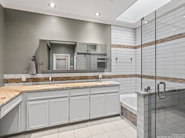 bathroom with double vanity, tile patterned flooring, and independent shower and bath