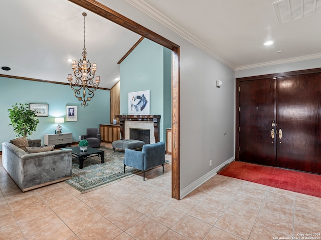 entrance foyer with ornamental molding, light tile patterned floors, and a chandelier