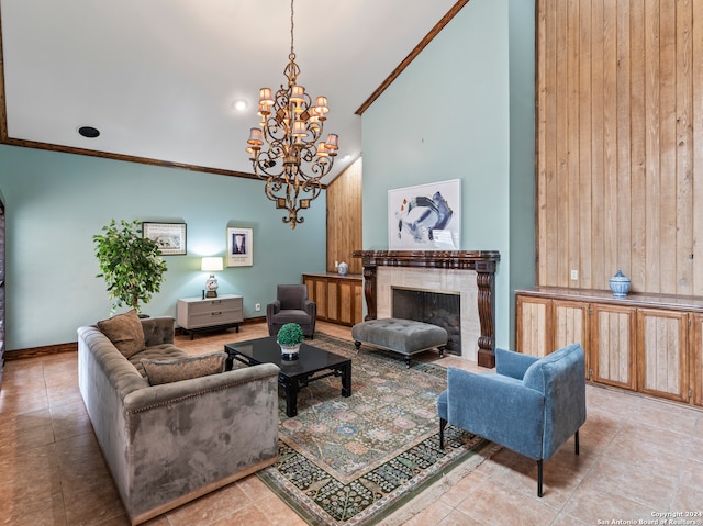 living room featuring an inviting chandelier, a premium fireplace, wooden walls, and light tile patterned floors