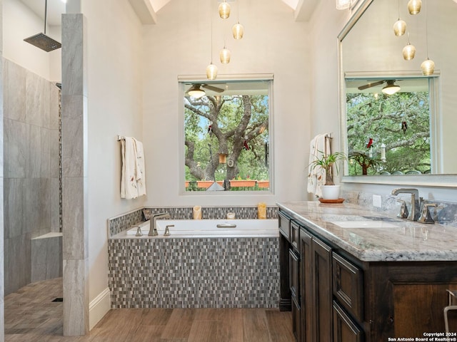 bathroom with shower with separate bathtub, vanity, and hardwood / wood-style floors