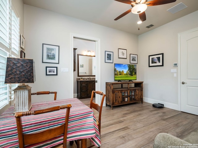 dining space featuring hardwood / wood-style flooring, a wealth of natural light, and ceiling fan