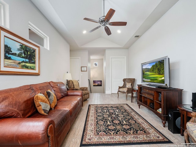 living room featuring high vaulted ceiling, ceiling fan, and light wood-type flooring