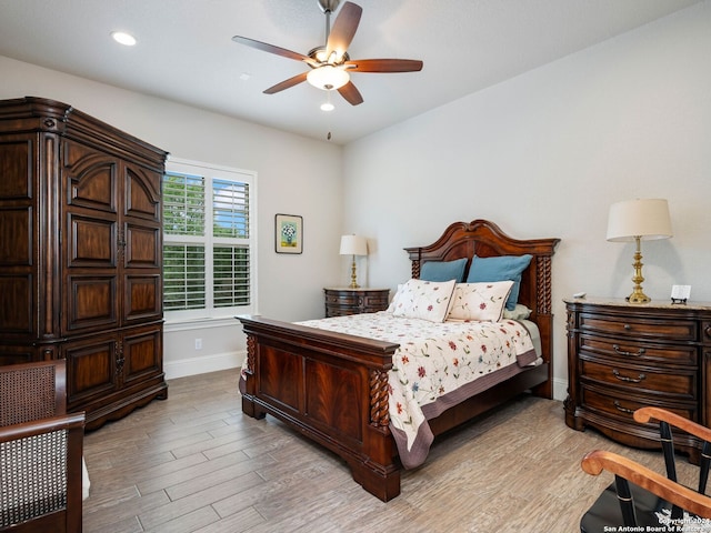 bedroom featuring ceiling fan and light hardwood / wood-style flooring