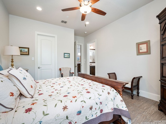 bedroom with ceiling fan and ensuite bath