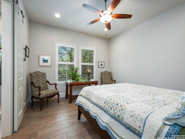 bedroom featuring hardwood / wood-style floors and ceiling fan