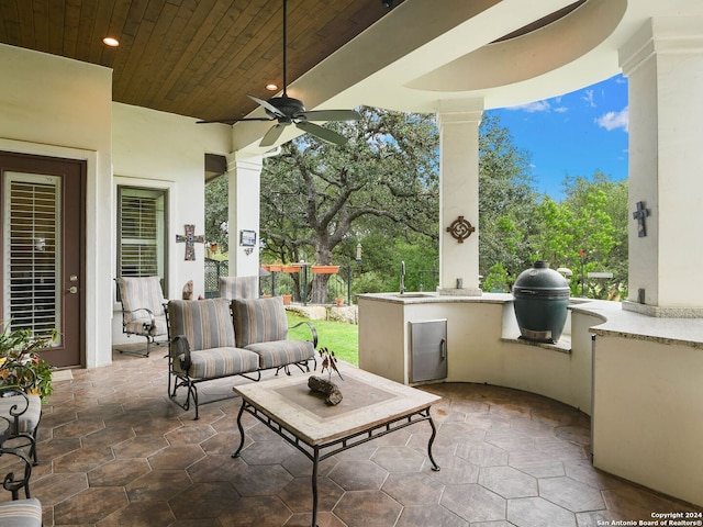 view of terrace with ceiling fan, sink, an outdoor kitchen, a grill, and an outdoor hangout area