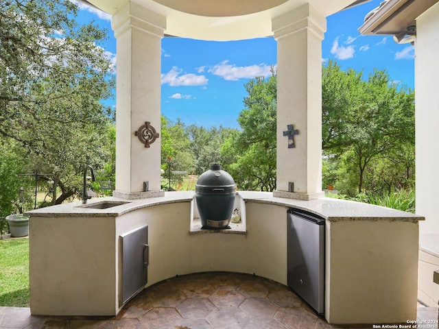 view of patio / terrace with sink and area for grilling