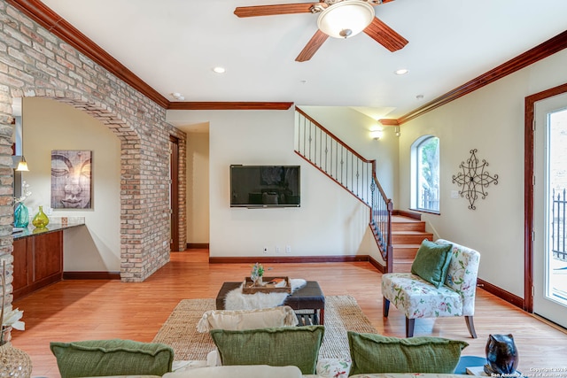 living room featuring plenty of natural light, ceiling fan, and hardwood / wood-style floors